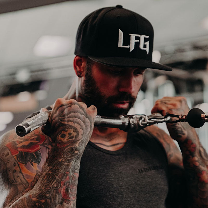 Man wearing black hat in gym